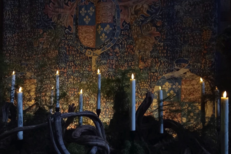 Tapestry and candles at Haddon Hall